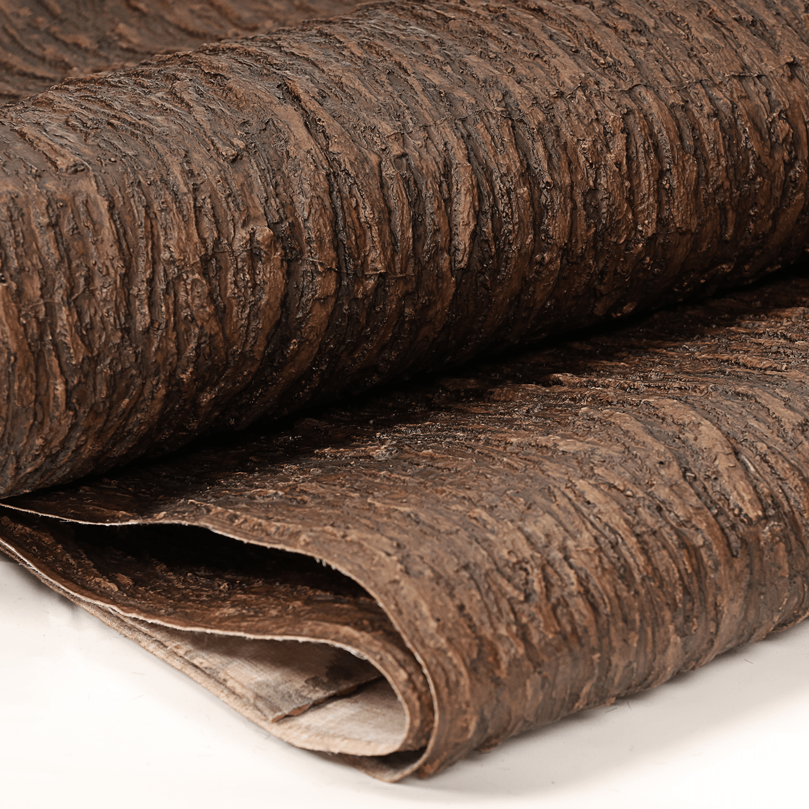 Close-up of NAHARO realistic artificial bark roll with textured brown surface